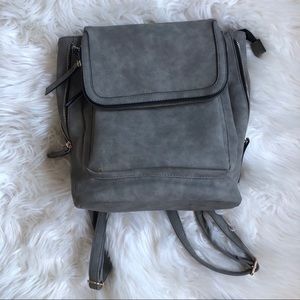 • grey backpack purse •